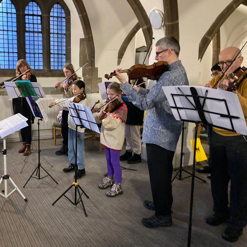 student taking violin lesson in Leeds